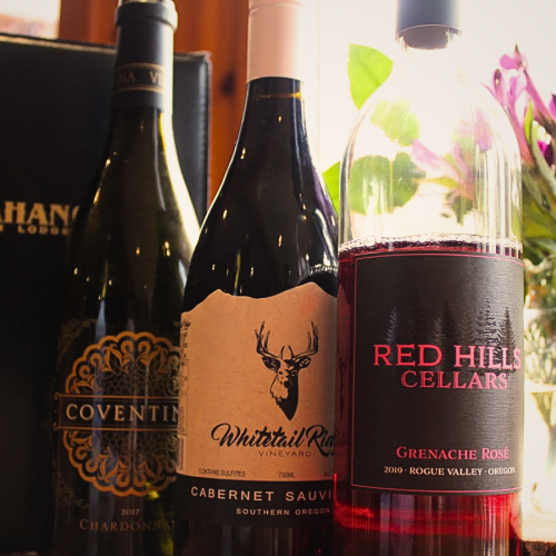 Three bottles of wine are displayed: Coventry Chardonnay, Whitetail Ridge Cabernet Sauvignon, and Red Hills Cellars Grenache Rosé. End of sentence.